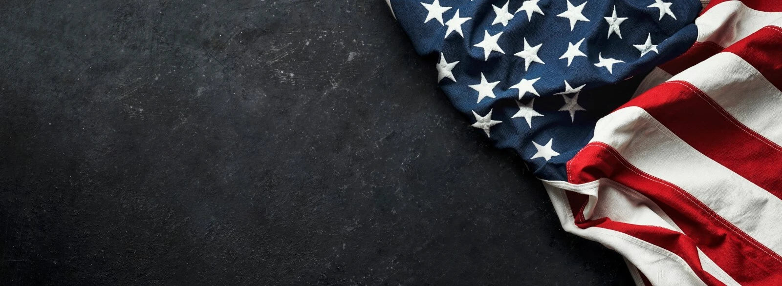 A website banner image of an American Flag on a dark gray surface