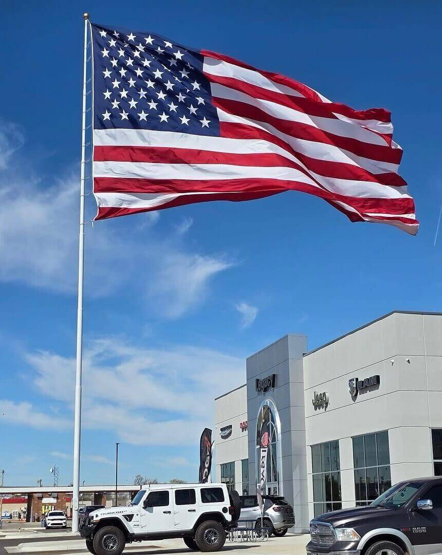 A picture of a 120X16 BigFlag Steel Flagpole flying a 50x80 American Flag by Action Flag