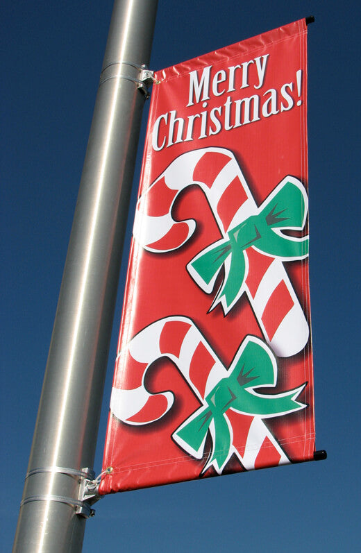 A product picture of a customer street banner displayed on a city street pole.