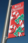 A product picture of a customer street banner displayed on a city street pole.