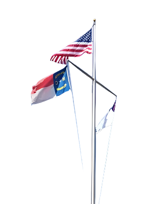 A nautical flagpole with an American, North Carolina, and Christian Flag