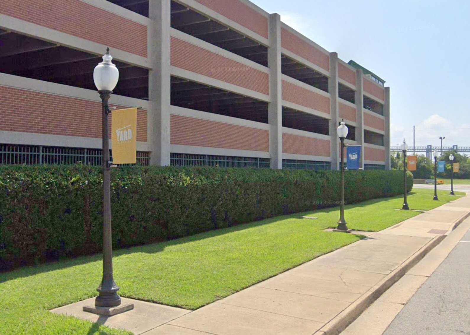 A product picture of custom street banners displayed on a city street pole.